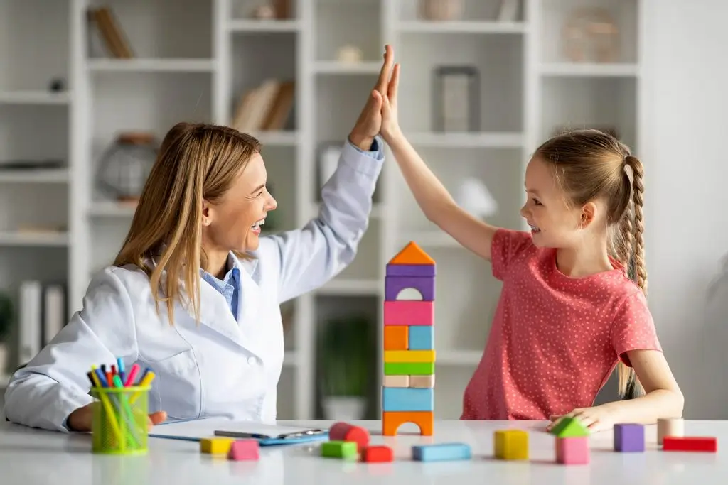 little girl giving high five